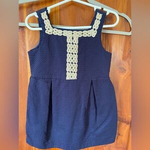 Girl’s navy blue summer dress with ivory and gold-metallic trim